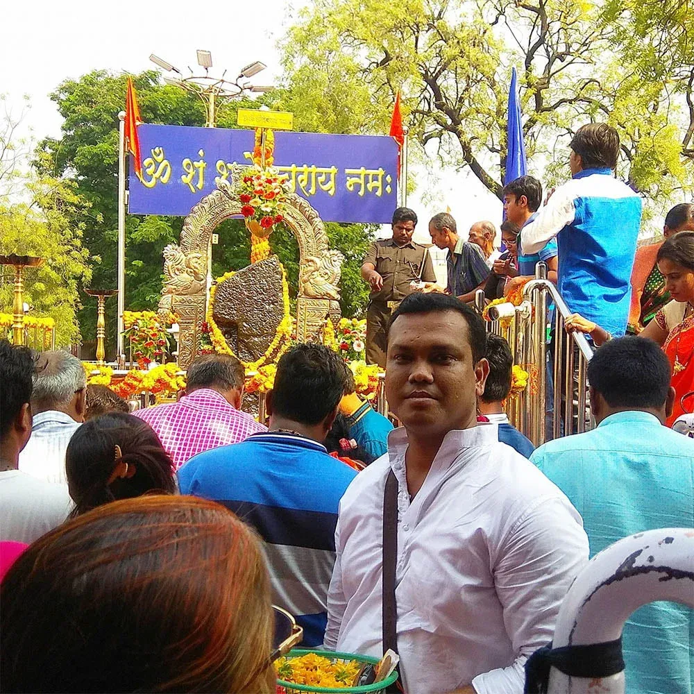 Astrologer Sailyajit Baruah with the idol of Shani Dev